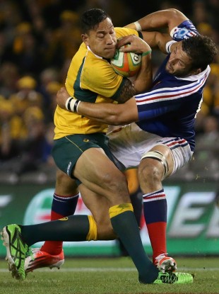 Israel Folau takes the ball into contact against Damien Chouly in Melbourne.