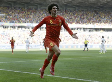 Marouane Fellaini celebrates his equalising goal as Belgium came from behind today.