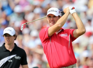 Harrington with McIlroy in the background.