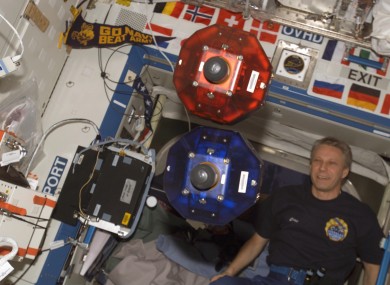 The SPHERES floating on board the International Space Station.