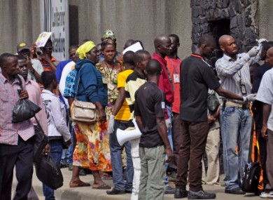 Workers have their temperature taken before entering the Freeport area, an important commercial port facility.