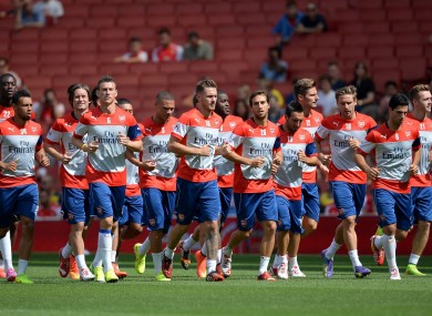 The Arsenal players warm up during the training session at the Emirates Stadium.