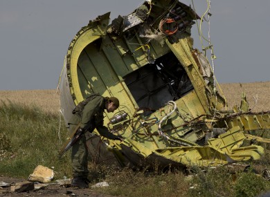 File photo dated 22 July, 2014, showing a Ukrainian separatist fighter at the MH17 crash site.