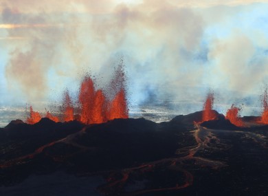 Fountains of lava, up to 60 meters high, spurt from a fissure in the ground on the north side of the Bardarbunga volcano.