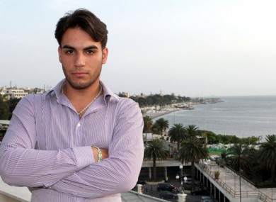 Riccardo Cordi' stands on a terrace in Reggio Calabria, Sicily, Italy with the Strait of Messina in the background. Cordi' was exiled to Messina during a pioneering anti-mafia program for juveniles, a kind of rehab away from the mob.