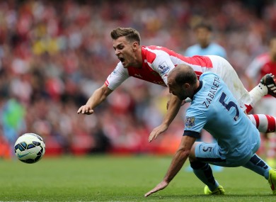 Arsenal's Aaron Ramsey is tackled by manchester City's Pablo Zabaleta.
