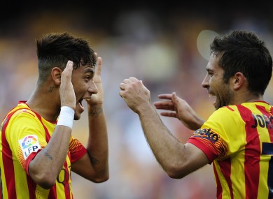 FC Barcelona's Neymar, left, celebrates after scoring with his teammate Jordi Alba.