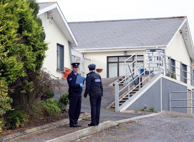 Gardaí outside the house where the two pensioners were found dead