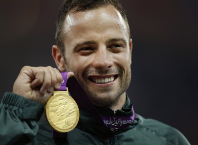 Oscar Pistorius with his gold medal after winning during the 2012 London Paralympics.