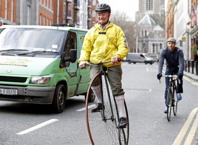 Pete Matthews, from Dublin, rides his penny farthing in the city centre.