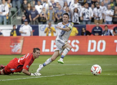 Robbie Keane with the winner.