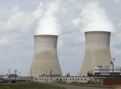 The cooling towers, right, and nuclear reactor containment buildings, left, at Plant Vogtle Nuclear Power Plant are shown in Waynesboro, Georgia.