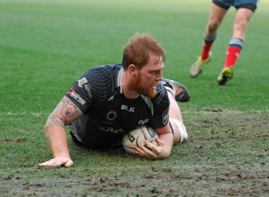 Dan Baker slides over for the game's opening try.