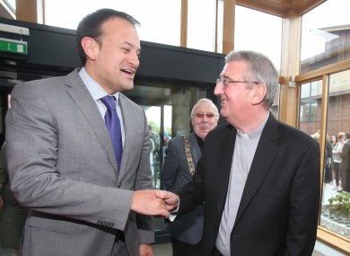 Archbishop Martin speaks with health minister Leo Varadkar on Saturday.