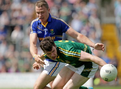 Meath's Harry Rooney is challenged by Dean Healy of Wicklow.