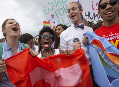 Hundreds celebrated outside the US Supreme Court in Washington on Friday after it ruled that same-sex couples could marry nationwide.