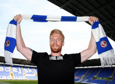 McShane wearing a t-shirt with the words 'I feel love' at the Madejski Stadium.