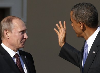 Obama gestures as he speaks to Russian President Vladimir Putin during arrivals for the G-20 Summit in St Petersburg, Russia in 2013.