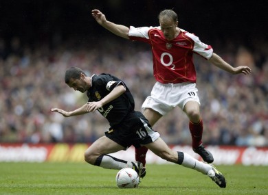 Keane challenges Arsenal's Denis Bergkamp in the 2005 FA Cup final at the Millennium Stadium.