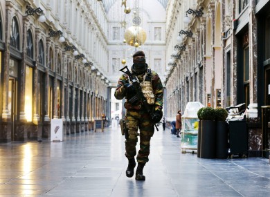 A Belgium army soldier walks through the Galeries Royal Saint-Hubert in Brussels last month during a terror alert.