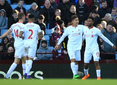 Liverpool's Daniel Sturridge (right) celebrates with team-mate Roberto Firmino after scoring his side's first goal.