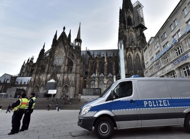 Police patrol in front of the main train station and the cathedral in Cologne.