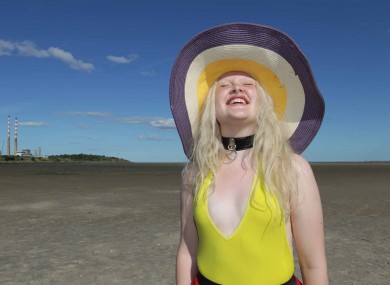 Megan Russell enjoys the sun and heat on Sandymount Strand in Dublin today.