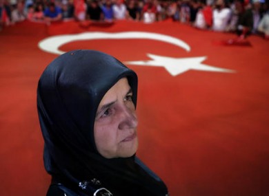 A woman takes part in an anti-coup rally at Taksim square in Istanbul yesterday.