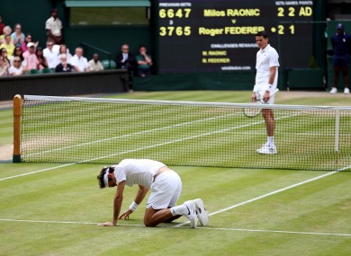 Down and out: Federer took a tumble in the fifth set.