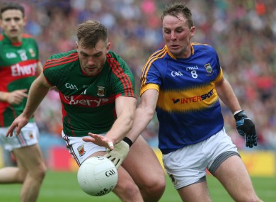 Peter Acheson in action today for Tipperary against Mayo's Aidan O'Shea.