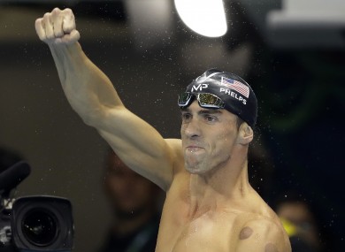 United States' Michael Phelps celebrates after winning the gold medal in the 200m butterfly.
