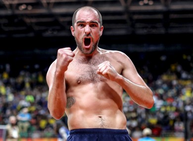 Scott Evans celebrates his victory over Brazil's Ygor Coelho de Oliveira.