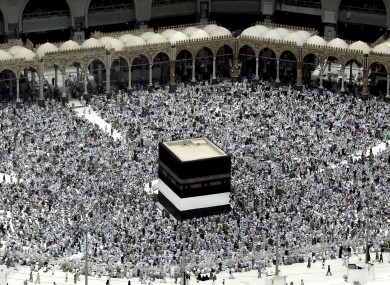 Muslim pilgrims in front of the Kaaba, Islam's holiest shrine, at the Grand Mosque in Mecca last night.