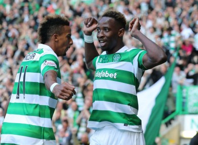 Moussa Dembele celebrates with Scott Sinclair.
