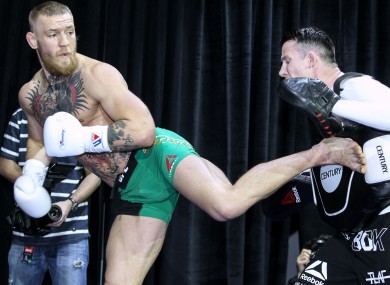 Conor McGregor working with Owen Roddy prior to his UFC 196 bout against Nate Diaz last March.