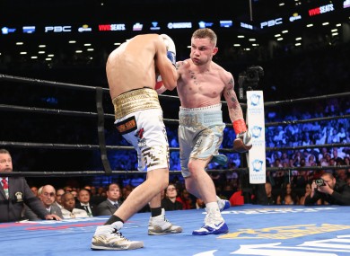 Carl Frampton in action against Leo Santa Cruz last July.