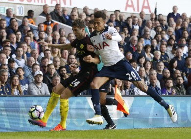 Tottenham Hotspur's Dele Alli, right, challenges Manchester City's John Stones for the ball in the reverse fixture earlier this season.