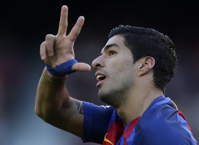 Luis Suarez celebrates after scoring during the Spanish La Liga soccer match between FC Barcelona and Las Palmas.