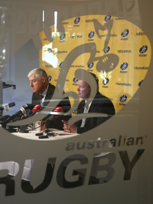 Australian Rugby Union Chairman Cameron Clyne, left, and CEO Bill Pulver discuss how Super Rugby is to be reduced from 18 to 15 teams next season.