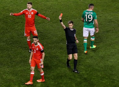 Wales defender Neil Taylor is sent off by referee Nicola Rizzoli.
