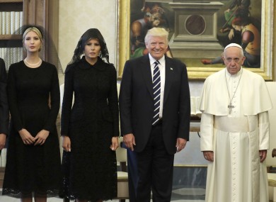 Donald Trump and Pope Francis pose for the press corps at the Vatican along with Trump's daughter Ivanka and wife Melania.