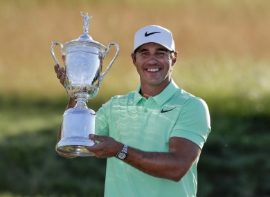 Brooks Koepka poses with the trophy after the US Open golf tournament.