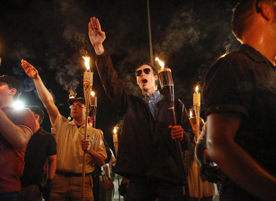 Multiple white nationalist groups march with torches through the UVA campus in Charlottesville.
