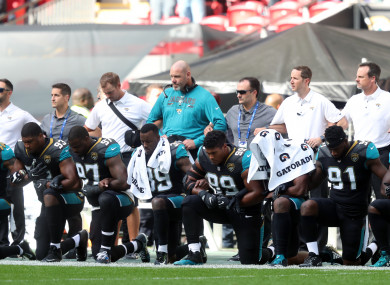 Jacksonville Jaguars players kneel in protest during the national anthem before the NFL International Series match at Wembley Stadium.