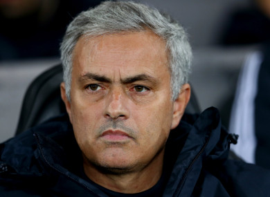Manchester United manager Jose Mourinho watches on.