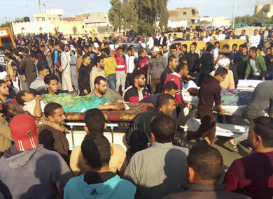 Injured people are evacuated from the scene of the attack.