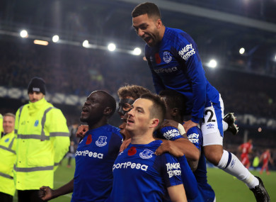 Everton's Leighton Baines (centre, bottom) celebrates scoring his side's third goal of the game from the penalty spot.
