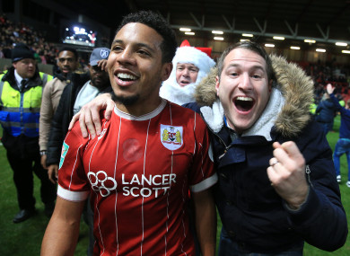 Korey Smith celebrates with a Bristol supporter after beating Manchester United on Wednesday.