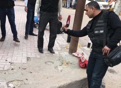 Egyptian policemen inspect the church attack site in Cairo.