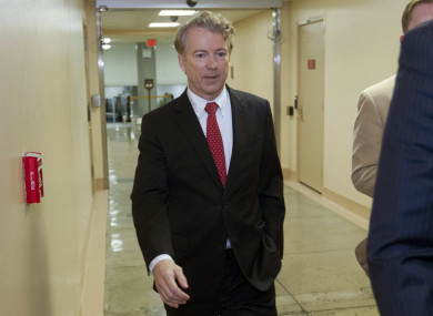 Senator Rand Paul walks to the senate chamber in the Capitol.